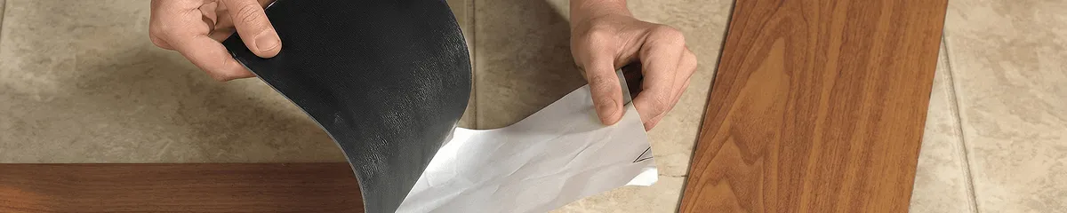 A professional installing vinyl flooring in Indianapolis, IN